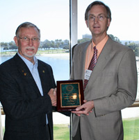 Walt Bentley receives the ESA award from Marlin Rice