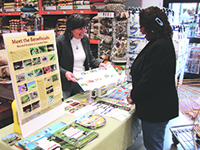 IPM Advocate Teresa Lavell shows a customer how to identify beneficial insects.