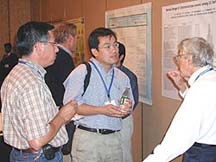 Barry Wilson (right), professor of Animal Science at UC Davis discusses his work at the Agricultural Health and Safety Conference