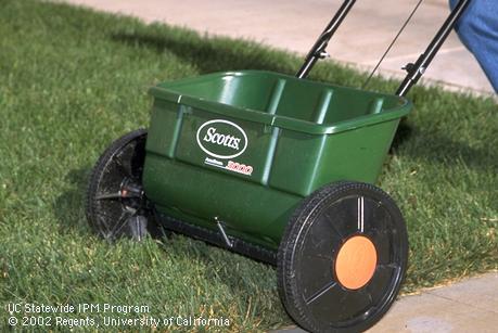 A drop fertilizer spreader.  