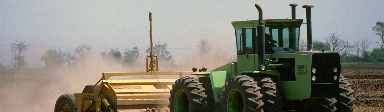 Laser leveling a field before planting.